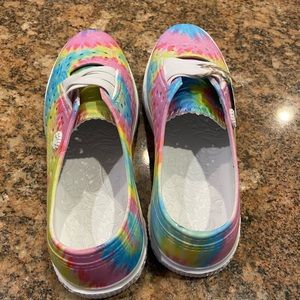 Brand new slip on water proof sneakers. Youth size 4